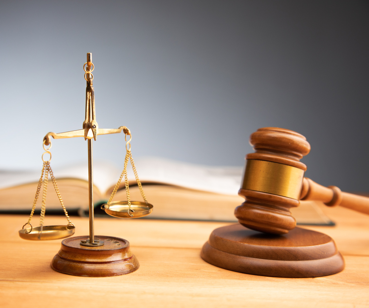 scales of justice with gavel and book